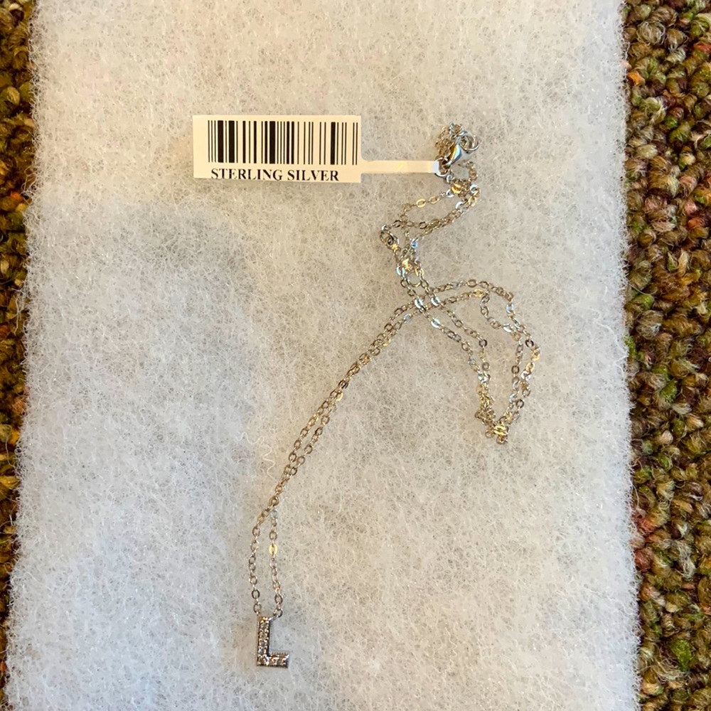 16 inch sterling silver necklace- letter “L” has diamonds in it.